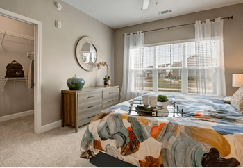 Bedroom, queen size bed, carpet, large window with drapes